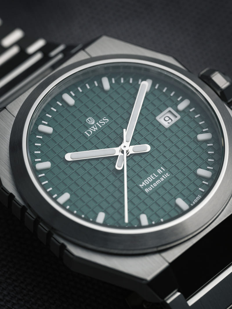 Upclose image of the DWISS Model A1 watch dial in green with stainless steel case 